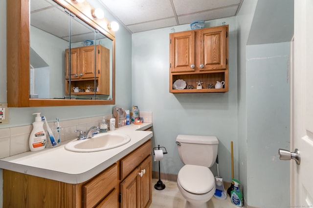 35 S St, Bethel, CT 06801 - bathroom featuring toilet, vanity, a drop ceiling, and baseboards