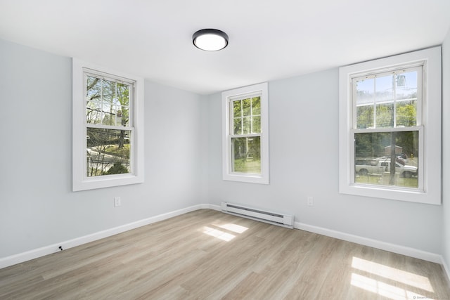 35 S St, Bethel, CT 06801 - unfurnished room with baseboard heating, light wood-style floors, healthy amount of natural light, and baseboards