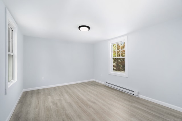 35 S St, Bethel, CT 06801 - unfurnished room featuring baseboard heating, light wood-type flooring, and baseboards