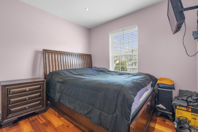 bedroom with wood finished floors and recessed lighting