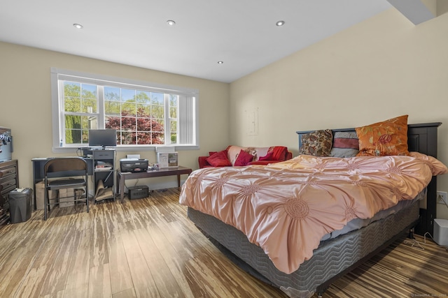 bedroom featuring wood finished floors and recessed lighting