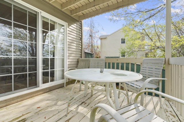 wooden terrace with outdoor dining space
