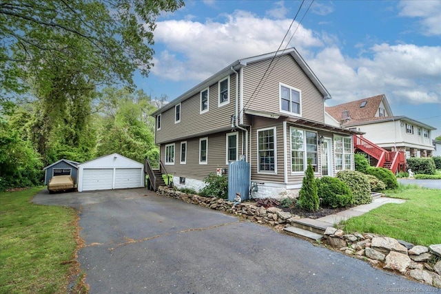 37A/K/A27 Oregon Ave, East Haven, CT 06512 - view of front of home featuring a garage, an outdoor structure, a front yard, and stairs
