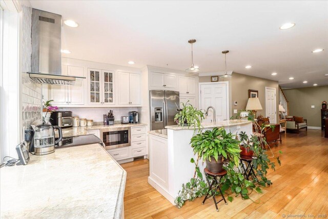 37A/K/A27 Oregon Ave, East Haven, CT 06512 - kitchen featuring stainless steel refrigerator with ice dispenser, island range hood, black microwave, white cabinetry, and recessed lighting