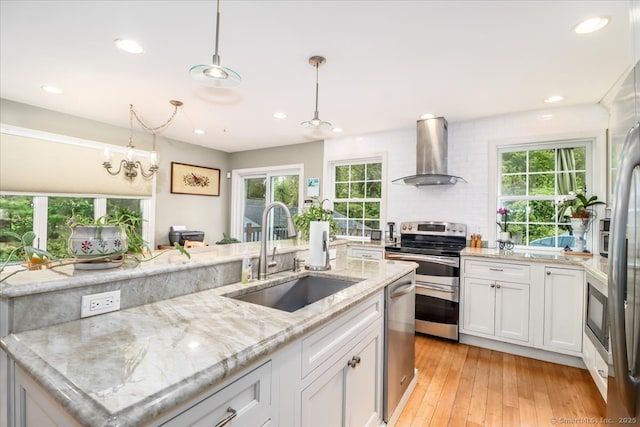 37A/K/A27 Oregon Ave, East Haven, CT 06512 - kitchen with wall chimney exhaust hood, a sink, appliances with stainless steel finishes, white cabinetry, and recessed lighting