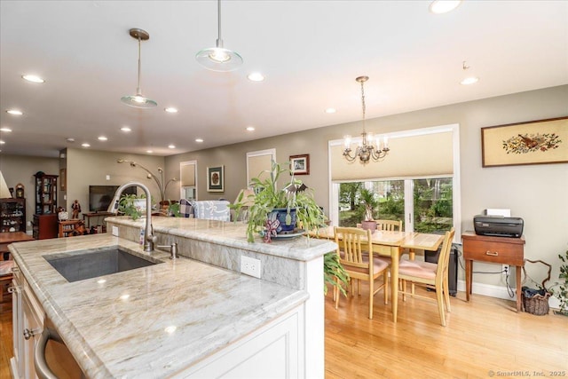 37A/K/A27 Oregon Ave, East Haven, CT 06512 - kitchen featuring a sink, recessed lighting, light wood-style flooring, light stone countertops, and open floor plan