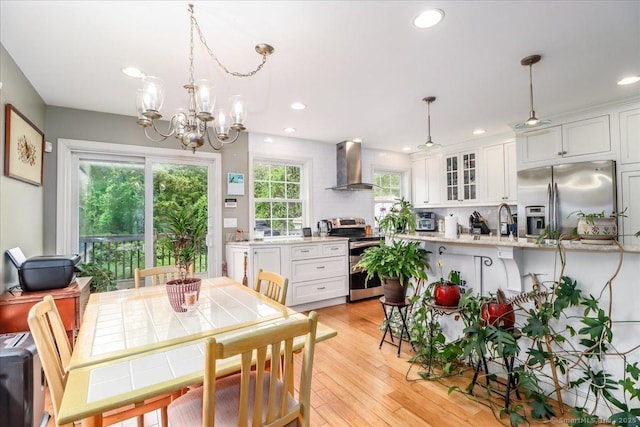37A/K/A27 Oregon Ave, East Haven, CT 06512 - dining room with a chandelier, recessed lighting, and light wood finished floors
