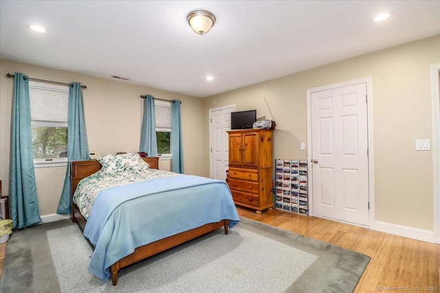 37A/K/A27 Oregon Ave, East Haven, CT 06512 - bedroom with multiple windows, wood finished floors, recessed lighting, and baseboards