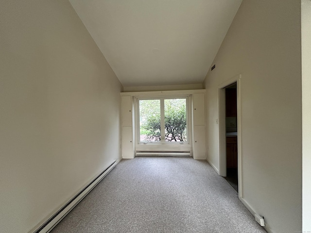 8 Pilgrim Hbr Unit A, Wallingford, CT 06492 - empty room with a baseboard radiator, vaulted ceiling, light carpet, and baseboards