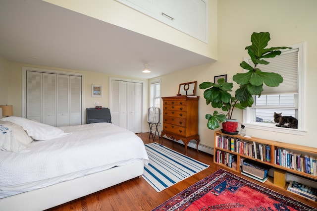 3 Clark Ave, Old Saybrook, CT 06475 - bedroom with multiple closets, wood finished floors, multiple windows, and a baseboard heating unit