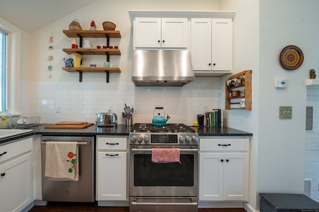 3 Clark Ave, Old Saybrook, CT 06475 - kitchen featuring appliances with stainless steel finishes, exhaust hood, lofted ceiling, backsplash, and white cabinetry