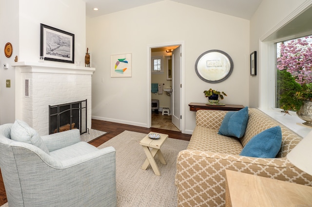 3 Clark Ave, Old Saybrook, CT 06475 - living room featuring dark wood-style floors, baseboards, lofted ceiling, and a fireplace