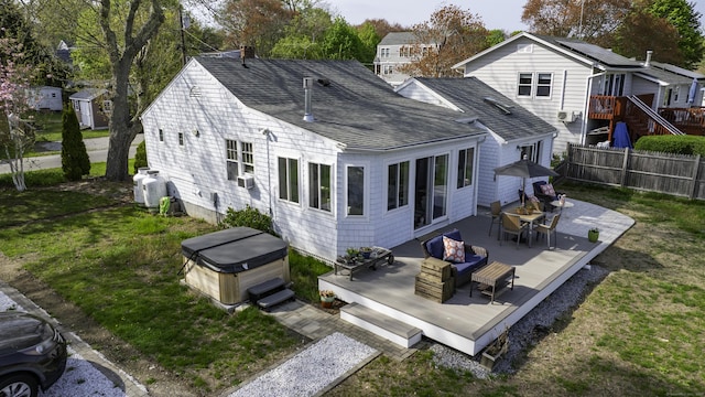 3 Clark Ave, Old Saybrook, CT 06475 - rear view of house featuring a hot tub, a wooden deck, roof with shingles, and outdoor dining space