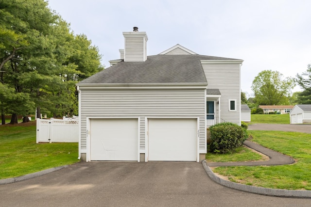 201 Greens Farm Rd Unit 201, Branford, CT 06405 - view of property exterior with a chimney, a garage, driveway, and a shingled roof