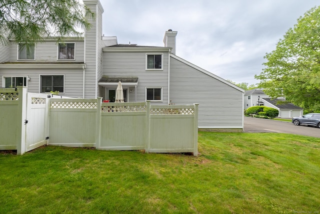 201 Greens Farm Rd Unit 201, Branford, CT 06405 - back of property featuring a chimney