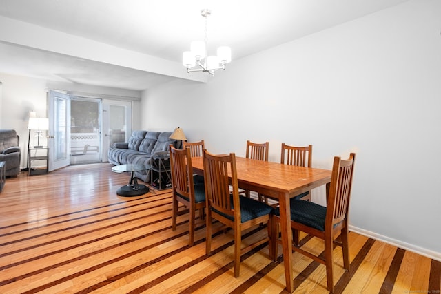 201 Greens Farm Rd Unit 201, Branford, CT 06405 - dining room with light wood-type flooring and a chandelier