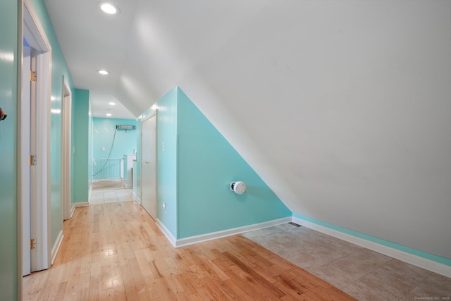bonus room featuring vaulted ceiling, recessed lighting, baseboards, and light wood-style floors