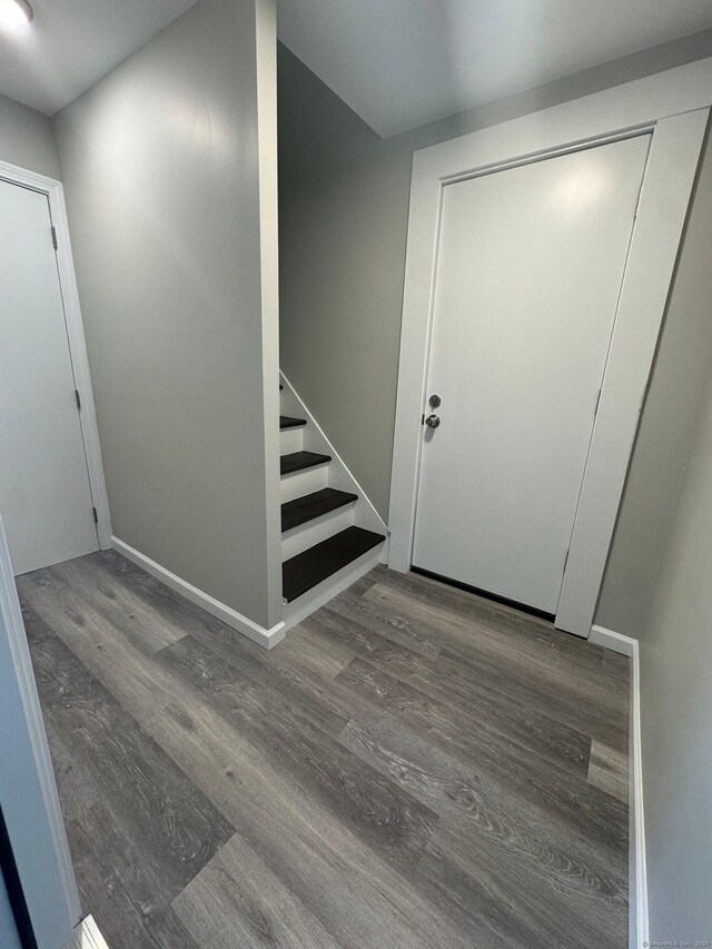 252-254 Liberty St, Meriden, CT 06450 - entryway with wood finished floors, baseboards, and stairs