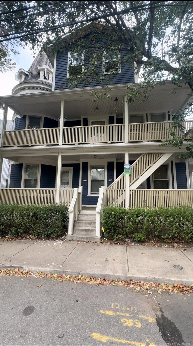 252-254 Liberty St, Meriden, CT 06450 - victorian-style house with covered porch and stairs