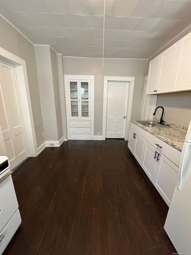 252-254 Liberty St, Meriden, CT 06450 - kitchen featuring a sink, dark wood finished floors, white cabinets, and ornamental molding