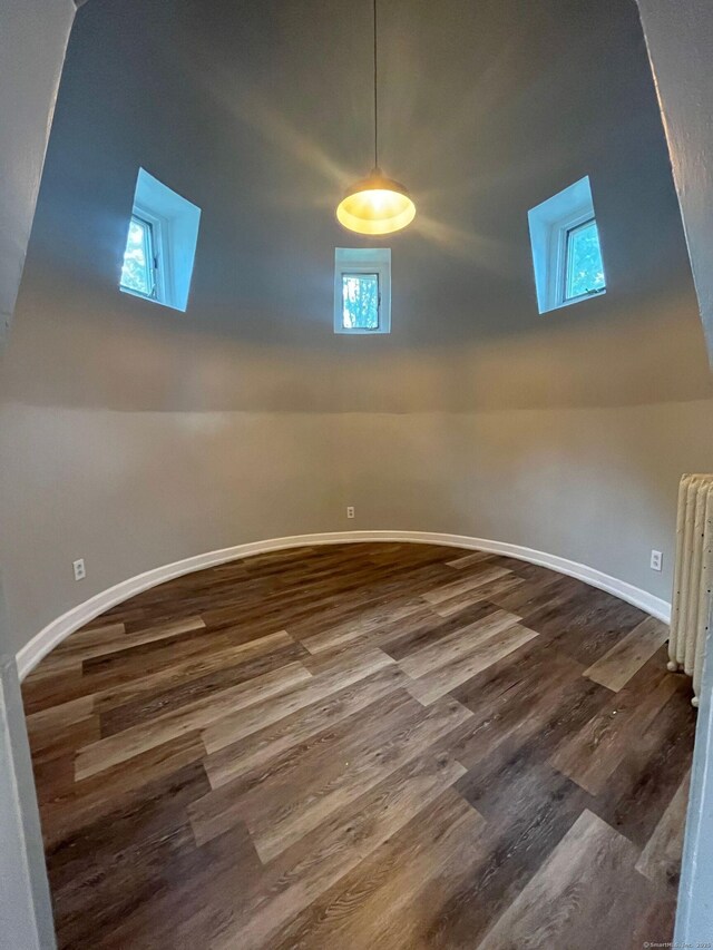 252-254 Liberty St, Meriden, CT 06450 - unfurnished room featuring dark wood-style flooring, basketball hoop, and baseboards