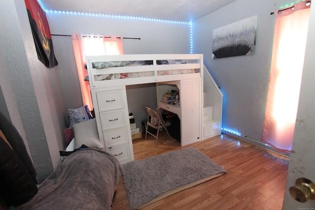 bedroom featuring light wood-style flooring