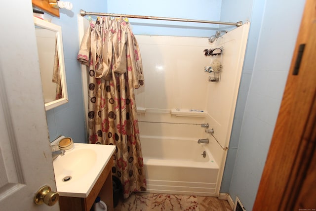 bathroom with shower / tub combo with curtain and vanity
