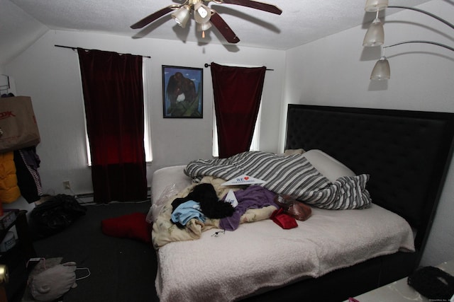 carpeted bedroom featuring vaulted ceiling and ceiling fan