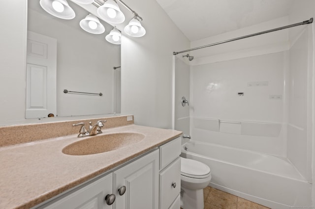 bathroom featuring vanity, toilet, bathtub / shower combination, and tile patterned floors