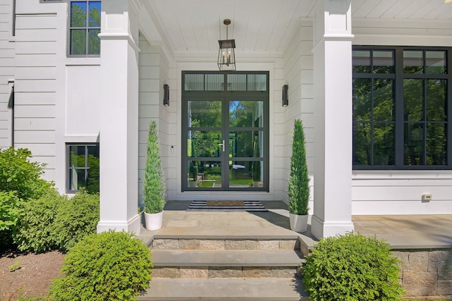 168 Proprietors Xing, New Canaan, CT 06840 - doorway to property featuring covered porch and french doors