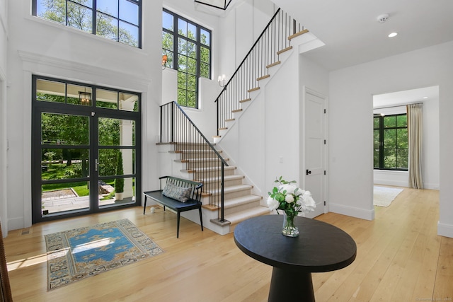 168 Proprietors Xing, New Canaan, CT 06840 - entrance foyer with stairs, hardwood / wood-style flooring, healthy amount of natural light, a towering ceiling, and recessed lighting