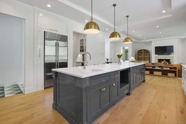 168 Proprietors Xing, New Canaan, CT 06840 - kitchen featuring built in refrigerator, a sink, white cabinets, recessed lighting, and light wood finished floors