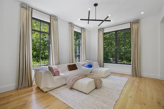 168 Proprietors Xing, New Canaan, CT 06840 - living room featuring hardwood / wood-style floors, a chandelier, baseboards, and recessed lighting