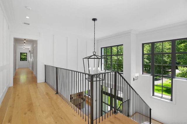 168 Proprietors Xing, New Canaan, CT 06840 - hall with an upstairs landing, ornamental molding, a chandelier, and light wood-style flooring