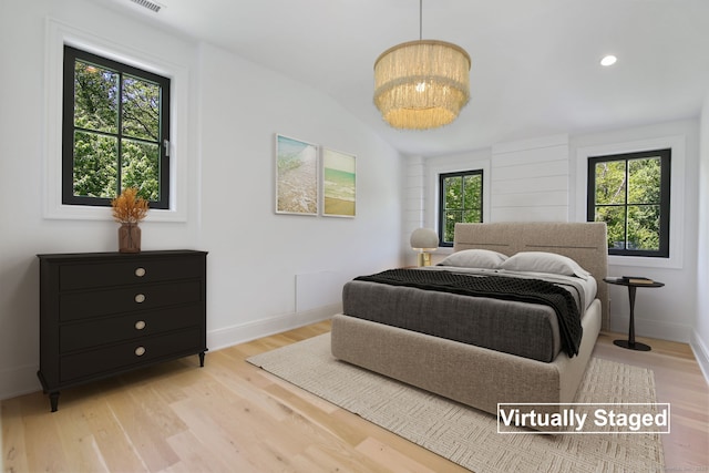 168 Proprietors Xing, New Canaan, CT 06840 - bedroom featuring light wood-type flooring, a chandelier, and baseboards