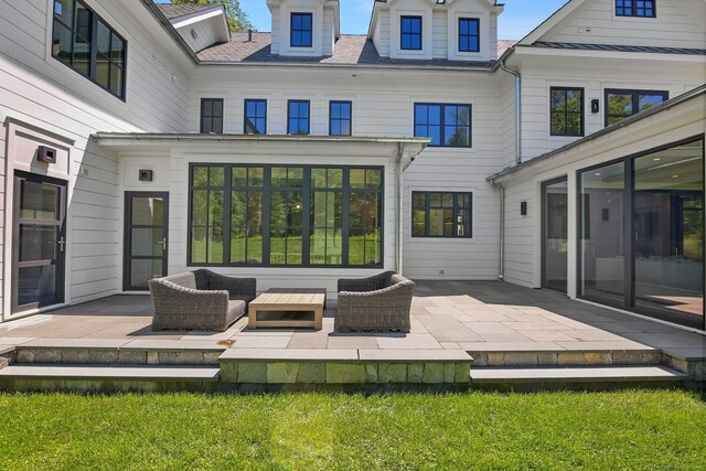 168 Proprietors Xing, New Canaan, CT 06840 - back of property featuring a patio area and an outdoor living space