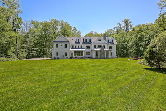 168 Proprietors Xing, New Canaan, CT 06840 - back of house featuring a lawn and a chimney