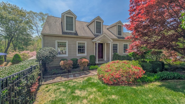 230 Ball Pond Rd, New Fairfield, CT 06812 - cape cod-style house with a shingled roof, a front lawn, and fence