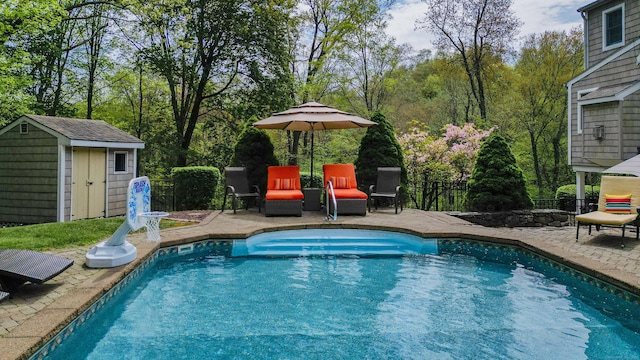 230 Ball Pond Rd, New Fairfield, CT 06812 - view of swimming pool with an outbuilding, a fenced in pool, fence, a patio area, and a storage unit