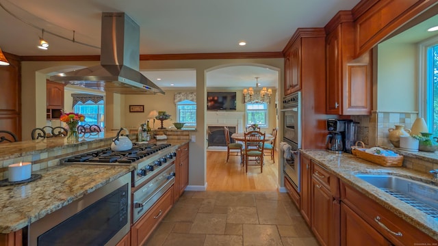 230 Ball Pond Rd, New Fairfield, CT 06812 - kitchen with backsplash, stainless steel appliances, plenty of natural light, and island exhaust hood