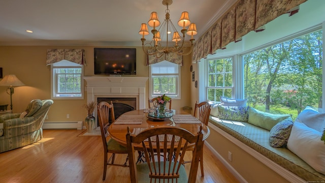 230 Ball Pond Rd, New Fairfield, CT 06812 - dining room with a baseboard radiator, baseboards, ornamental molding, a fireplace with flush hearth, and light wood-style floors