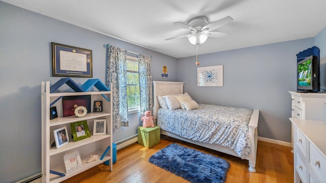 230 Ball Pond Rd, New Fairfield, CT 06812 - bedroom featuring a baseboard heating unit, baseboards, ceiling fan, and wood finished floors