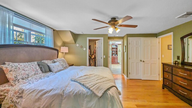 230 Ball Pond Rd, New Fairfield, CT 06812 - bedroom with light wood-type flooring, visible vents, and a ceiling fan