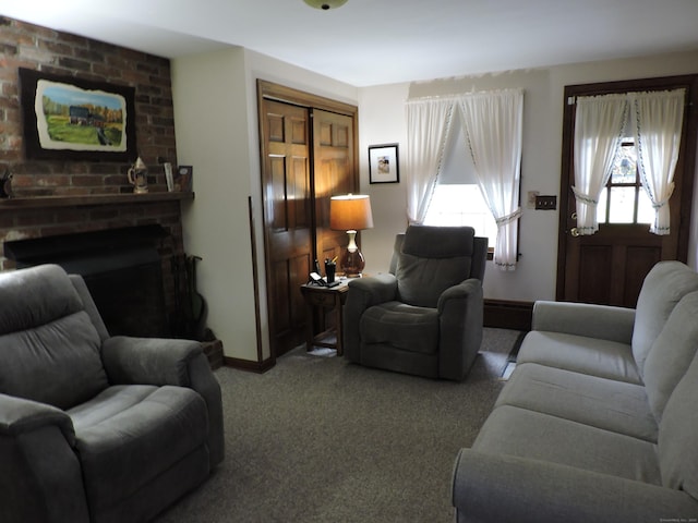 carpeted living area with baseboards