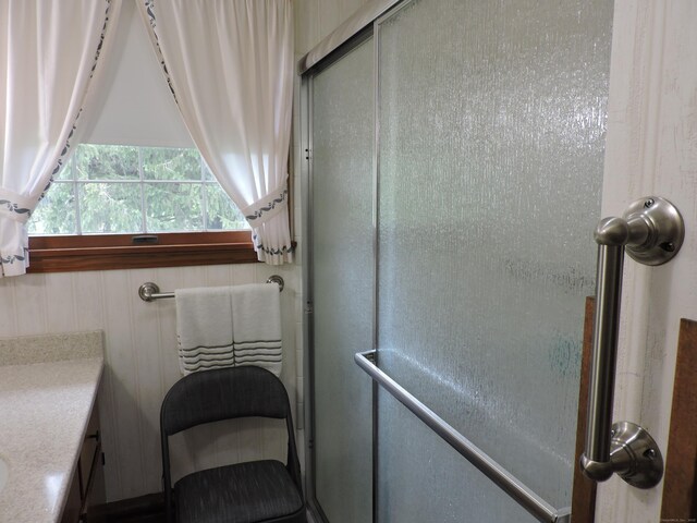 bathroom featuring a shower stall
