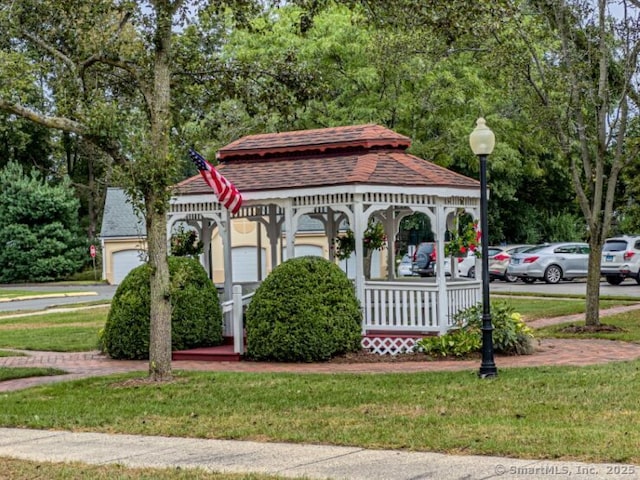view of property's community featuring a yard and a gazebo