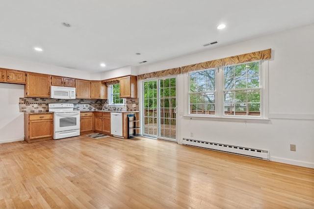 kitchen featuring white appliances, a baseboard heating unit, light wood-style floors, backsplash, and recessed lighting
