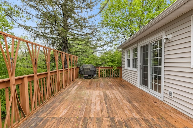 deck featuring a grill