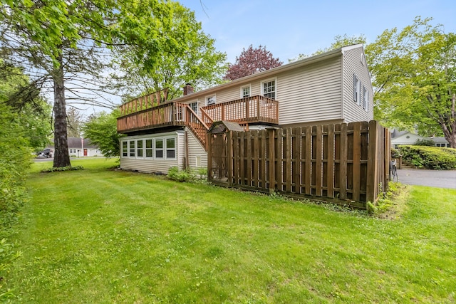 back of property featuring a deck