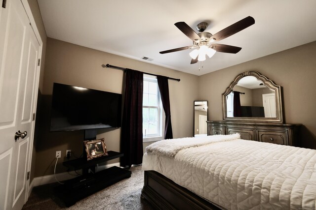 bedroom featuring carpet flooring, baseboards, and a ceiling fan